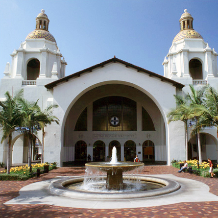San Diego Union Station white facade with one large archway, fountain and two symettrical towers 
