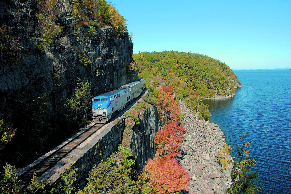 Adirondack Amrak Train Route over cliff and autumn leaves