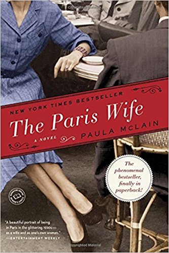 The cover of "The Paris Wife book" with woman below head at a cafe table